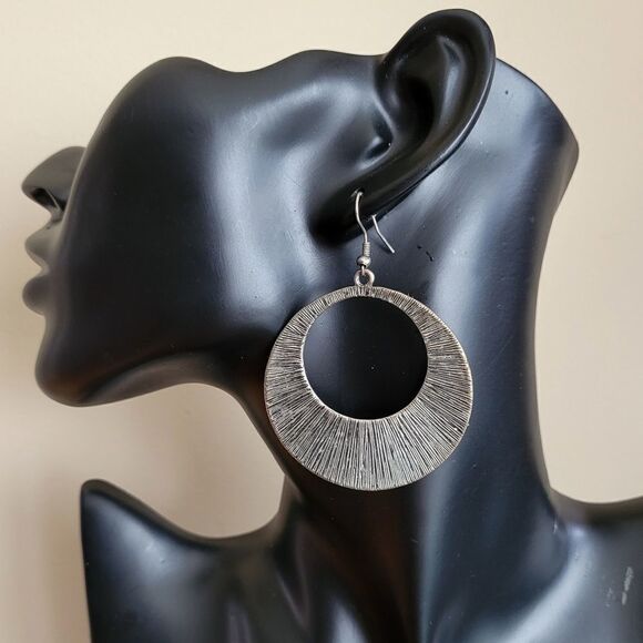 Large silver tone textured earring. Fashion Jewelry - Picture 1 of 3